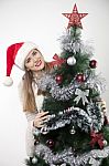 Pretty Woman With Christmas Tree Stock Photo