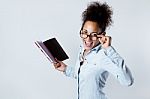 Pretty Young Black Woman Taking Notes At Home Stock Photo