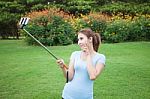 Pretty Young Female Tourist Takes Travel Selfie Stock Photo