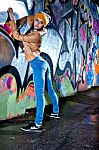 Pretty Young Girl And Graffiti Stock Photo