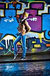 Pretty Young Girl And Graffiti Stock Photo