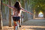 Pretty Young Girl Riding Bike In A Forest Stock Photo