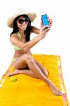 Pretty Young Girl With Green Bikini Taking Selfies With Her Smar Stock Photo