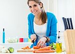 Pretty Young Woman Cooking At Home Stock Photo