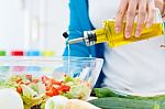 Pretty Young Woman Cooking At Home Stock Photo