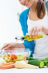 Pretty Young Woman Cooking At Home Stock Photo