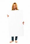 Pretty Young Woman Holding A White Banner Stock Photo