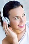 Pretty Young Woman Listening Music At Home Stock Photo