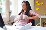 Pretty Young Woman Relaxing One Moment In Her Office Stock Photo