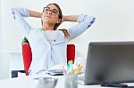 Pretty Young Woman Relaxing One Moment In Her Office Stock Photo