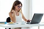 Pretty Young Woman Using Her Laptop At Home Stock Photo