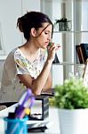 Pretty Young Woman Using Her Laptop In The Office Stock Photo