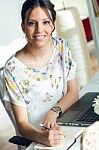 Pretty Young Woman Using Her Laptop In The Office Stock Photo