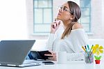 Pretty Young Woman Working In Her Office Stock Photo