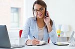 Pretty Young Woman Working In Her Office Stock Photo