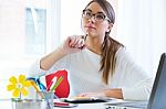 Pretty Young Woman Working In Her Office Stock Photo