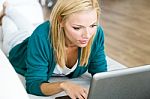 Pretty Young Woman Working With Laptop At Home Stock Photo