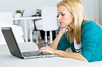 Pretty Young Woman Working With Laptop At Home Stock Photo