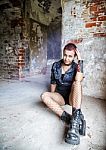 Punk Girl Sitting On The Floor Stock Photo