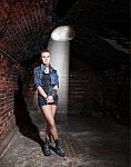 Punk Girl Standing In The Dark Room Stock Photo