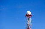 Radar Dome In The Sea With Blue Sky And Clouds Stock Photo