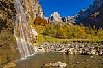 Rainbow In A Waterfall In The Mountains Stock Photo