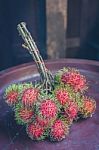 Rambutan On Wood Stock Photo