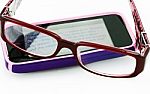 Reading An E-Mail With Glasses Stock Photo