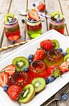 Red And Green Jelly Served With Fruit Stock Photo