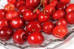 Red Cherries In A Dish Of Water Stock Photo