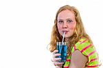 Redhead Girl Drinking Blue Soft Drink Stock Photo