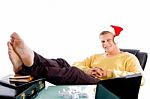 Relaxing Male Wearing Christmas Hat Stock Photo