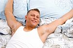 Relaxing Man In Bed Stock Photo