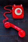 Retro Vintage Red Landline Unhang On Wooden Background Stock Photo