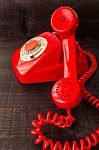 Retro Vintage Red Landline Unhang On Wooden Background Stock Photo