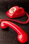 Retro Vintage Red Landline Unhang On Wooden Background Stock Photo