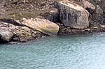 Rocks And Blue Water Near The Niagara Falls Stock Photo