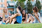 Running Girls Having Fun In The Park With Mobile Phone Stock Photo