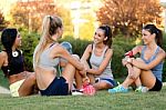 Running Girls Having Fun In The Park With Mobile Phone Stock Photo