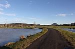 Rural Road Through Water Stock Photo