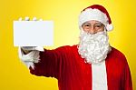 Saint Nick Flashing A Blank Placard To The Camera Stock Photo