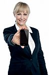 Sales Executive Displaying Brand New Multimedia Phone Stock Photo