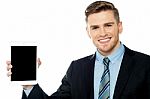 Salesman Displaying New Tablet Device Stock Photo