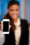 Saleswoman Displaying Newly Launched Mobile Stock Photo