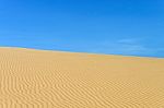 Sand Dune And Blue Sky Stock Photo