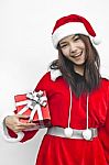 Santa Claus Hat With Red Christmas Gift Box Stock Photo