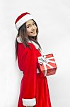 Santa Claus Hat With Red Christmas Gift Box Stock Photo