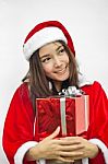 Santa Claus Hat With Red Christmas Gift Box Stock Photo