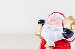 Santa Claus Holding Gold Star And Bell Stock Photo