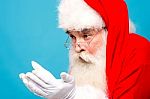 Santa Claus Looking His Open Palms Stock Photo